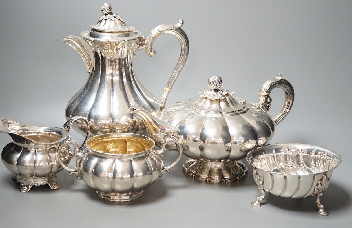 A matched harlequin 19th and 20th century fluted silver four piece tea set, teapot The Barnards, London, 1838, sugar bowl Edward & John Barnard, London, 1857, cream jug marks rubbed, and coffee pot William Hutton & Sons,